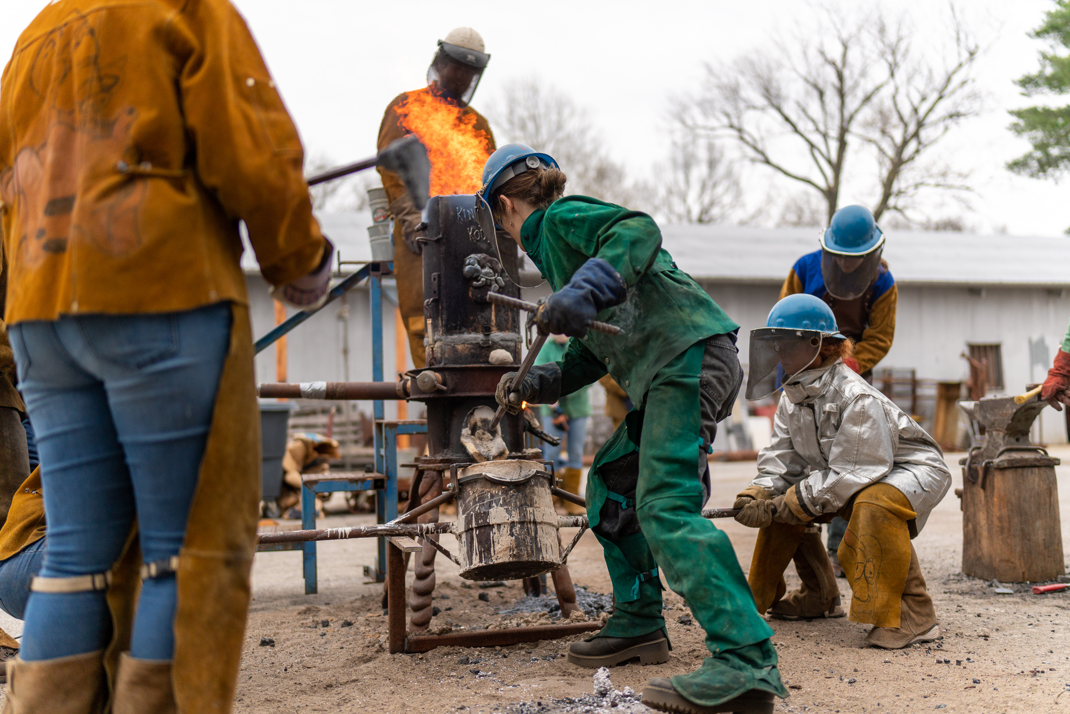 students pouring iron 